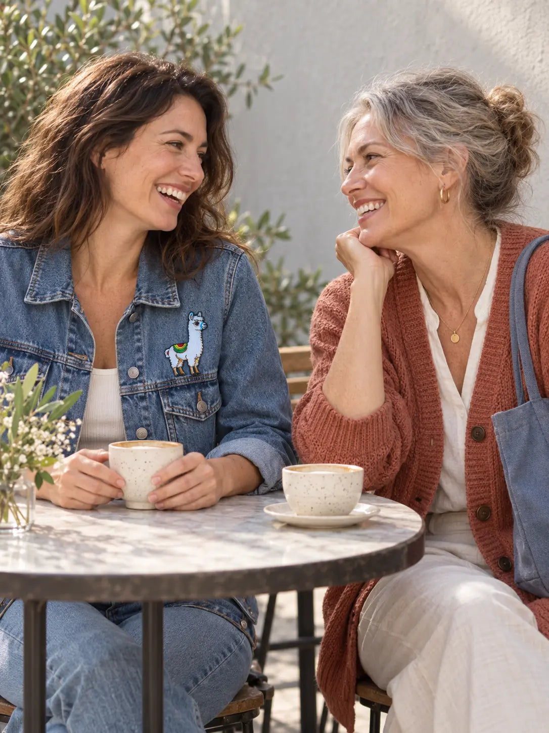 AI mood image: two friends, one wearing a small alpaca patch on her denim jacket
