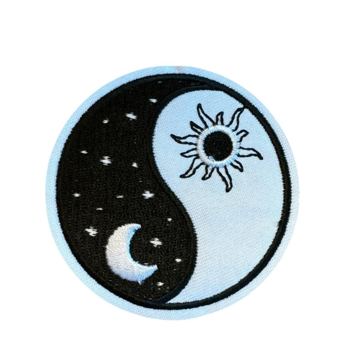 Black and white yin-yang patch with sun and moon