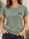 Panda strass patch op de borst van een groen shirt