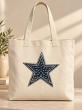 Zwarte ster strass patch op een naturel canvas tas